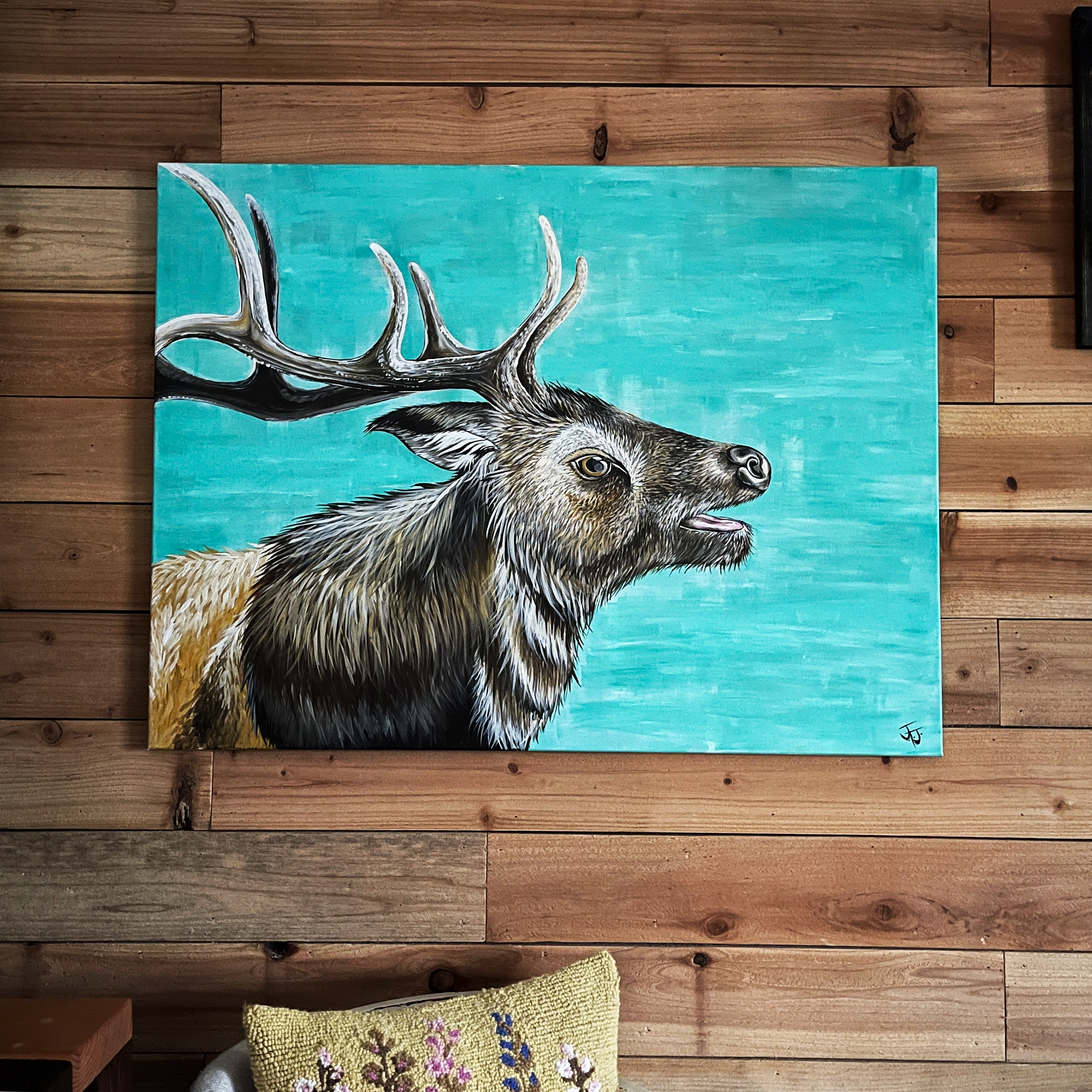 Painting of an elk on a wooden wall