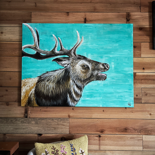 Painting of an elk on a wooden wall
